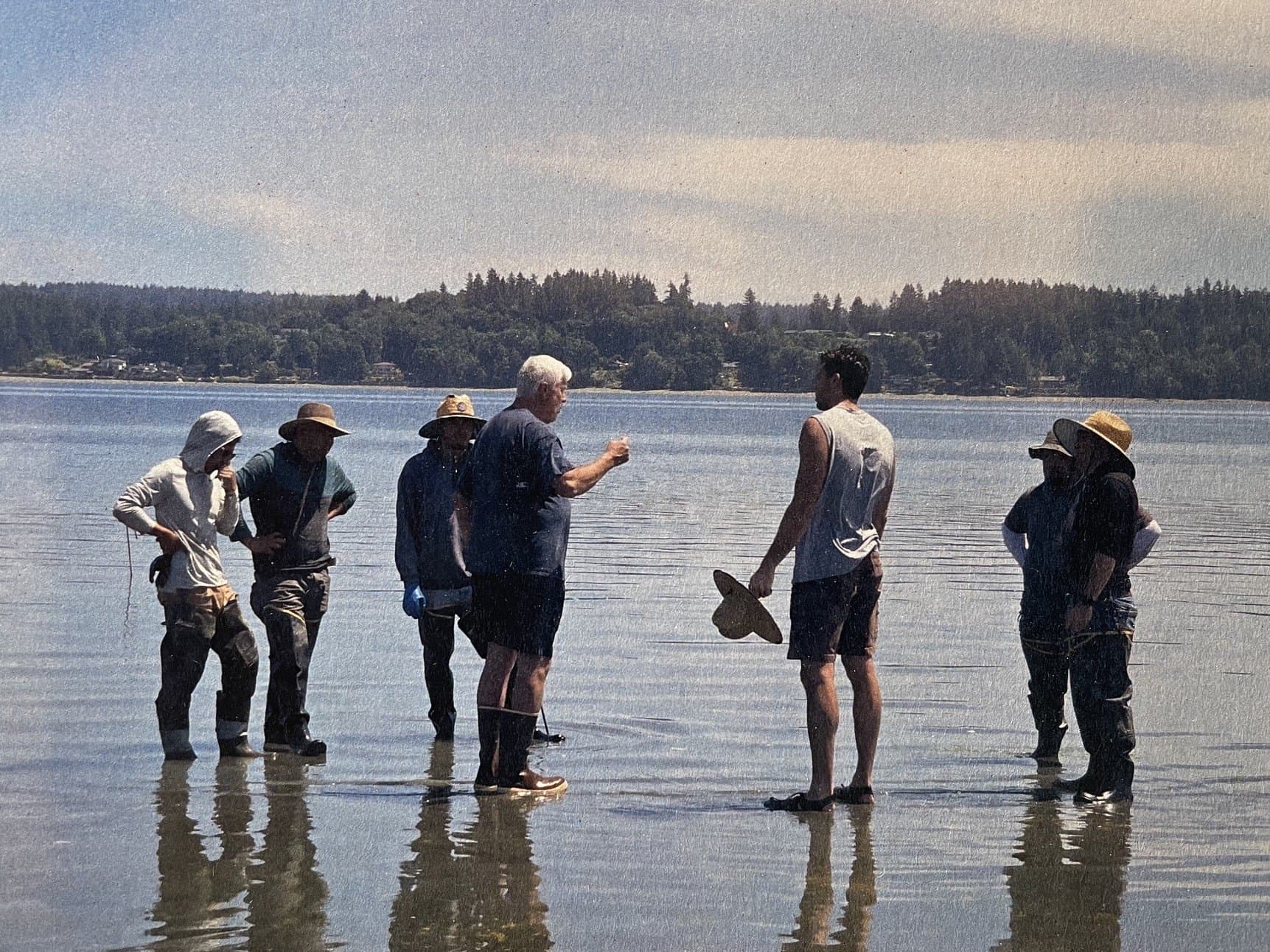 A group standing out on the tideflats at low water during a Minterbrook farm tour