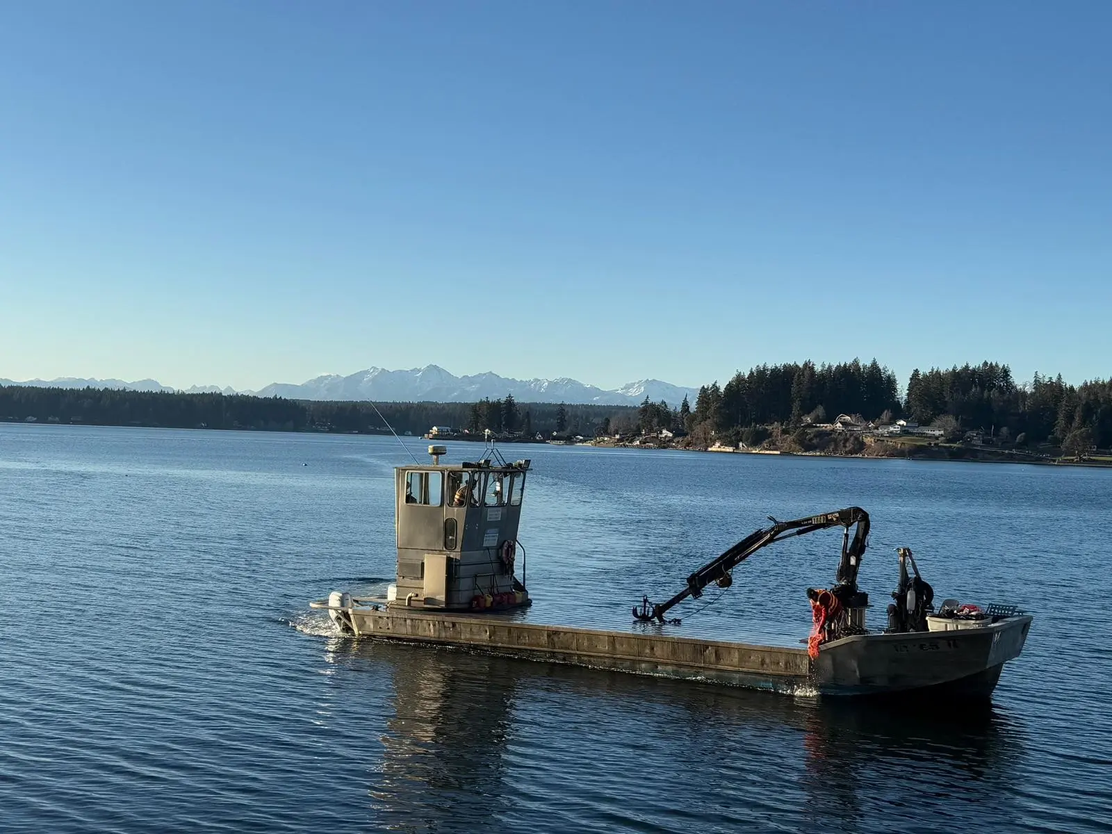 The barge working with the Olympics behind
