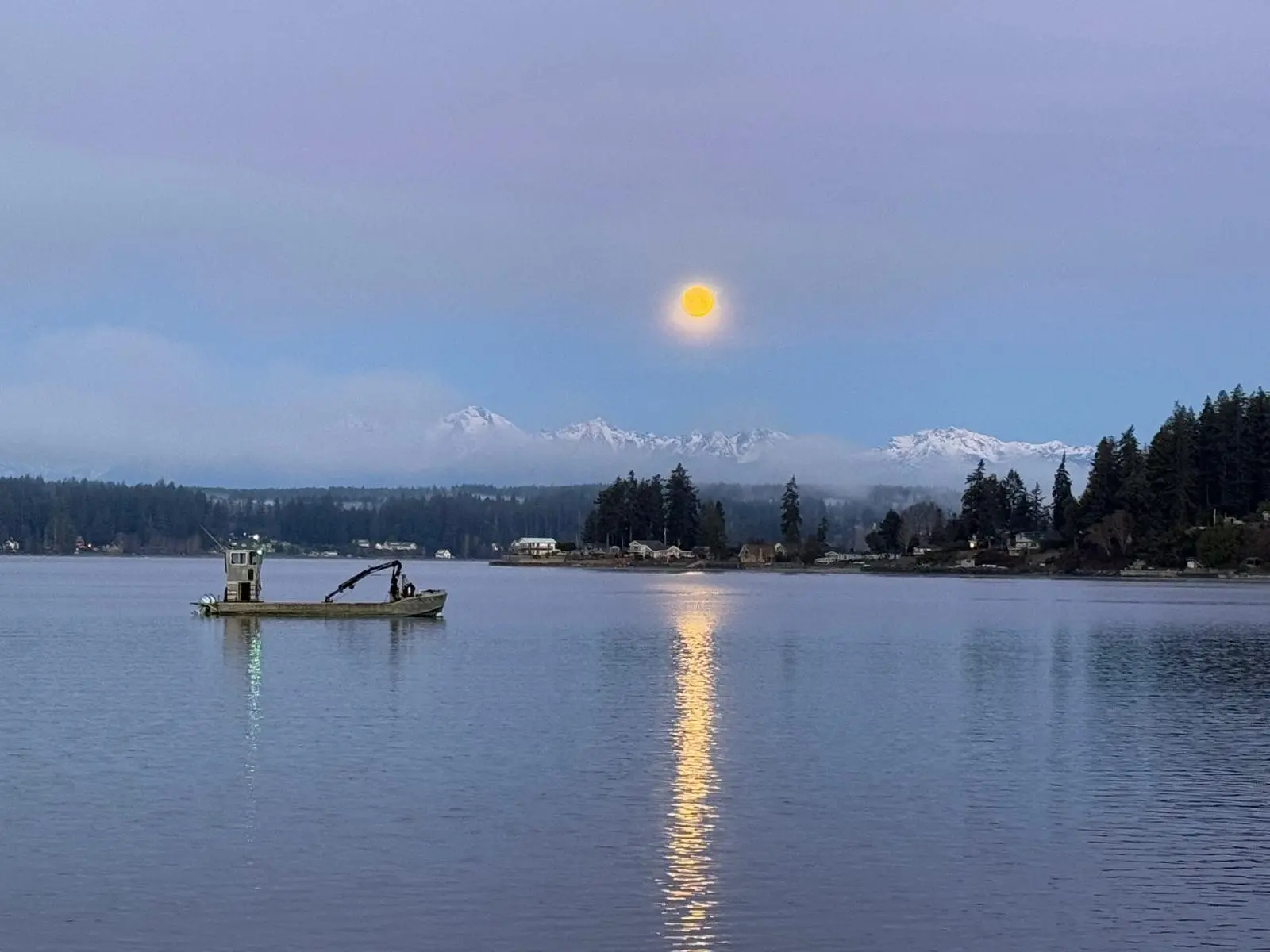 Moonrise over the bay at dusk