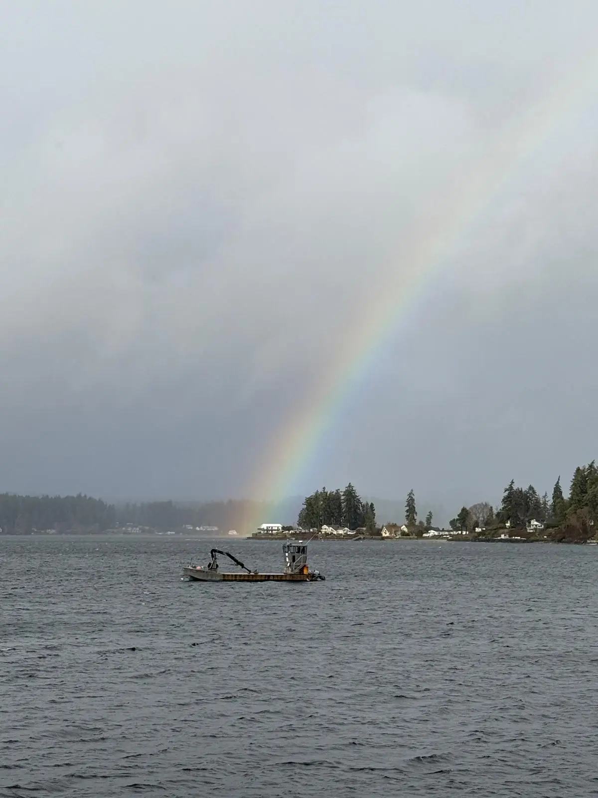 A rainbow over the working barge