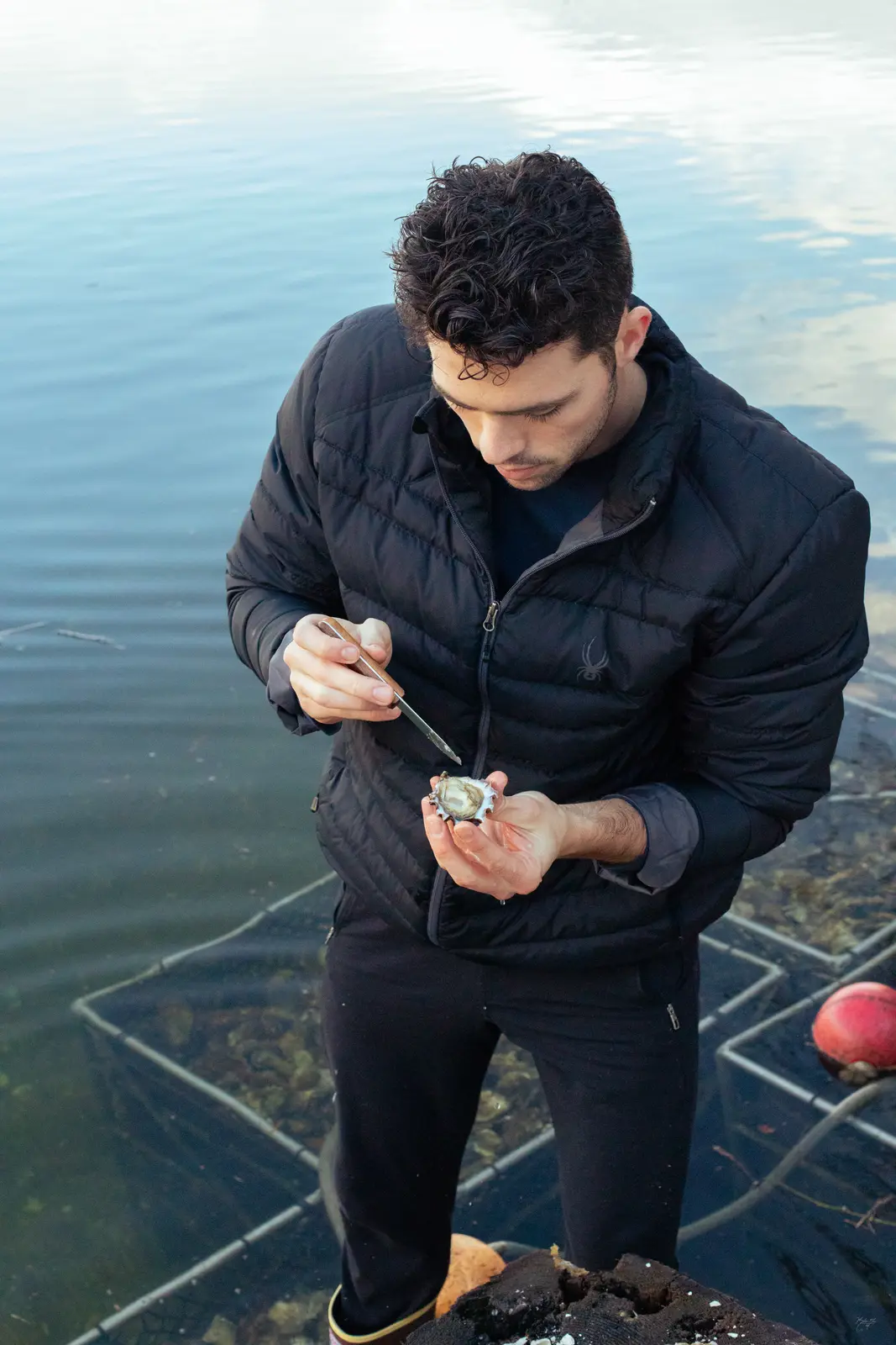 Shucking at the water's edge